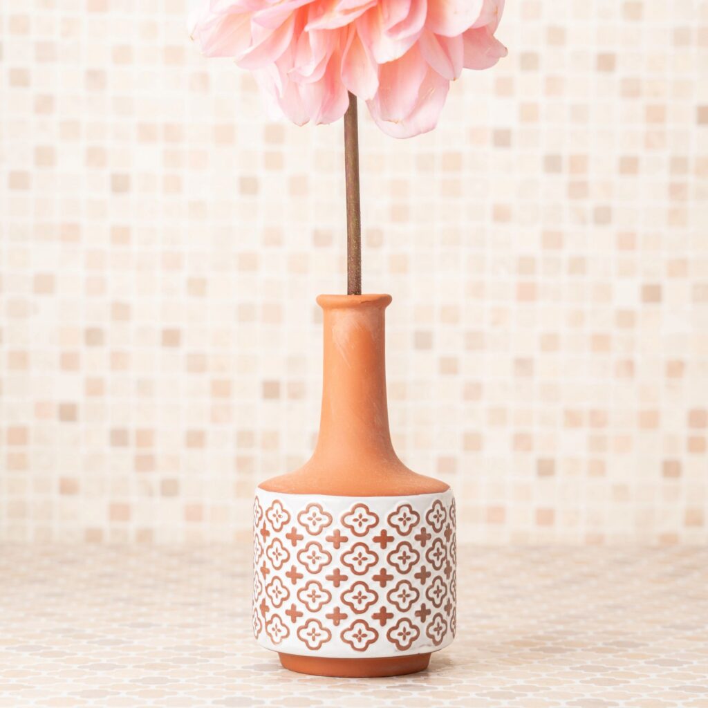 Dahlia and clay vase