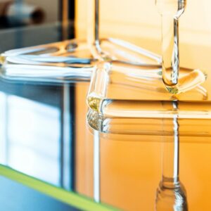 Abstract colorful glass installation, transparent bent details